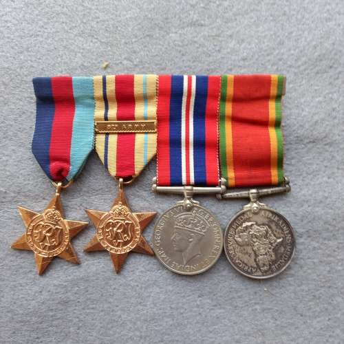 SET OF 4 FULL SIZE WW 11 MEDALS COMPLETE WITH RIBBONS AND BAR. NAMED E.E. WRIGHT No. 812