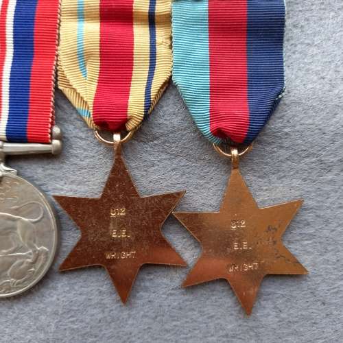 SET OF 4 FULL SIZE WW 11 MEDALS COMPLETE WITH RIBBONS AND BAR. NAMED E.E. WRIGHT No. 812