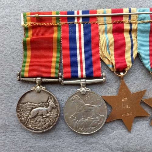 SET OF 4 FULL SIZE WW 11 MEDALS COMPLETE WITH RIBBONS AND BAR. NAMED E.E. WRIGHT No. 812