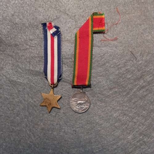 2 X WW2 MINI-MEDALS WITH RIBBON. 1)THE FRANCE AND GERMANY STAR. 2) THE AFRICA SERVICE MEDAL.