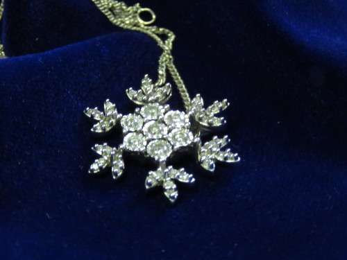 Stunning solid10kt white gold snowflake diamond pendant