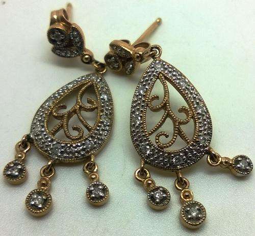 STUNNING**375 9ct GOLD earings with 12 diamonds on each earring** have a look at the pictures *