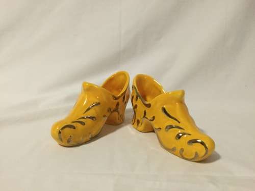 Black Vase with Yellow Shoes