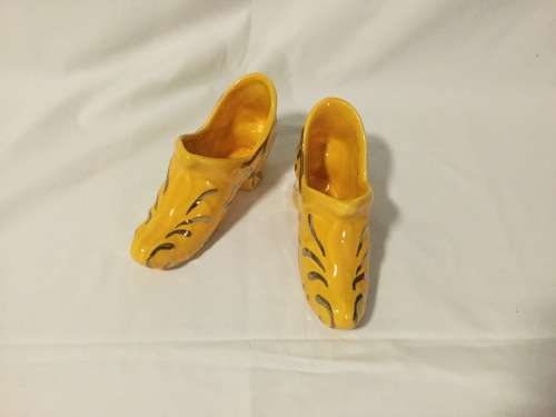 Black Vase with Yellow Shoes