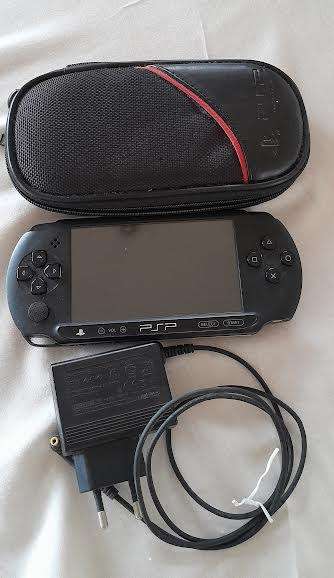 PSP E1000 Street handheld console plus 8 games.