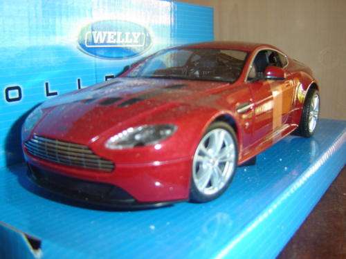 Lovely Ruby Red Aston Martin V 12 Scale 1/24 by WELLY -New in Display Box.Delivery by Coerier