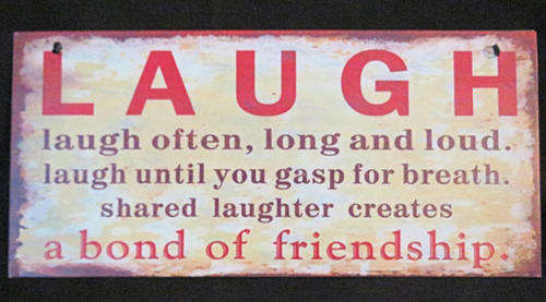 Vintage looking Laugh Often metal wall sign 28x13cm
