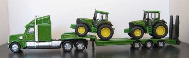 LOW LOADER WITH 2 JOHN DEERE TRACTORS by SIKU in 1/87 HO SCALE.(NEW BOXED)