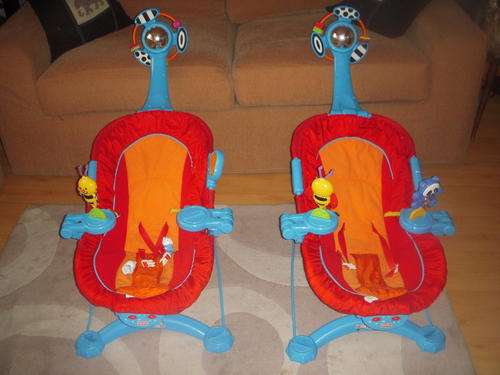 Vibrating baby bouncer chair with music and carousel