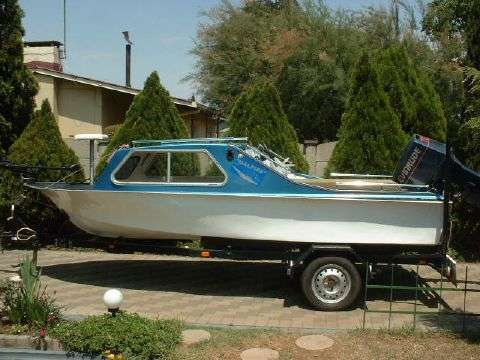 Bass Boat - Cabin Cruiser with trailer, without engine.