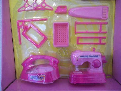 Girls  Play set, includes battery operated iron, sewing machine and accessories.