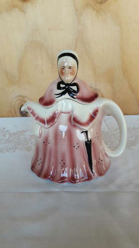 A lady Staffordshire teapot