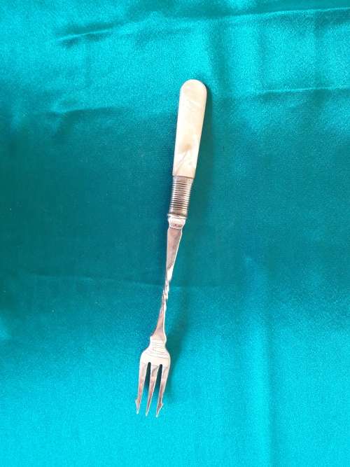A beautiful silver plated, mother of pearl pickle fork
