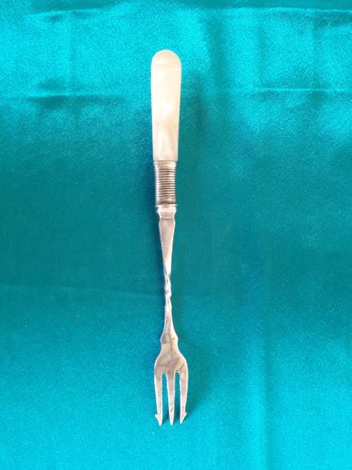 A beautiful silver plated, mother of pearl pickle fork