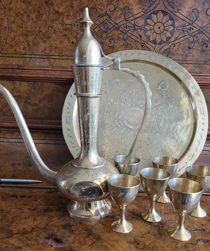 Miniature arty solid brass decanter and six small goblets. on its own tray Very beautifully crafted