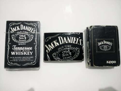JACK DANIELS COLLECTABLES- Zippo lighter, belt buckle and playing cards
