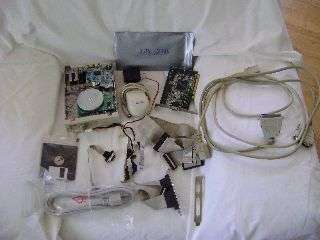 Assortment of components,a digital scanner barcode reader programming sheet and a Floppy Drive