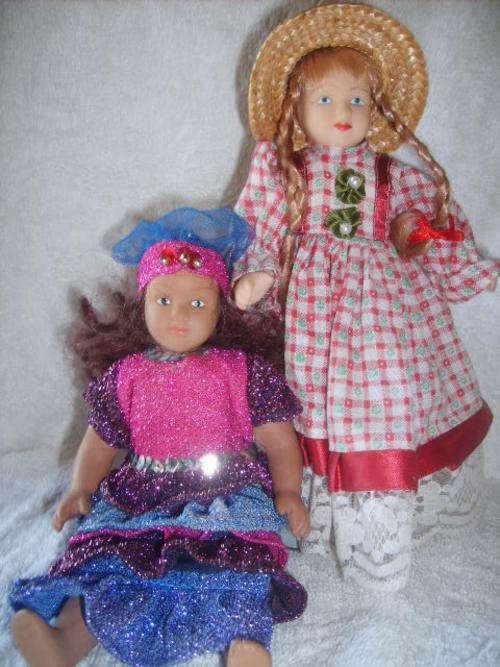 SET OF TWO PORCELAIN DOLLS