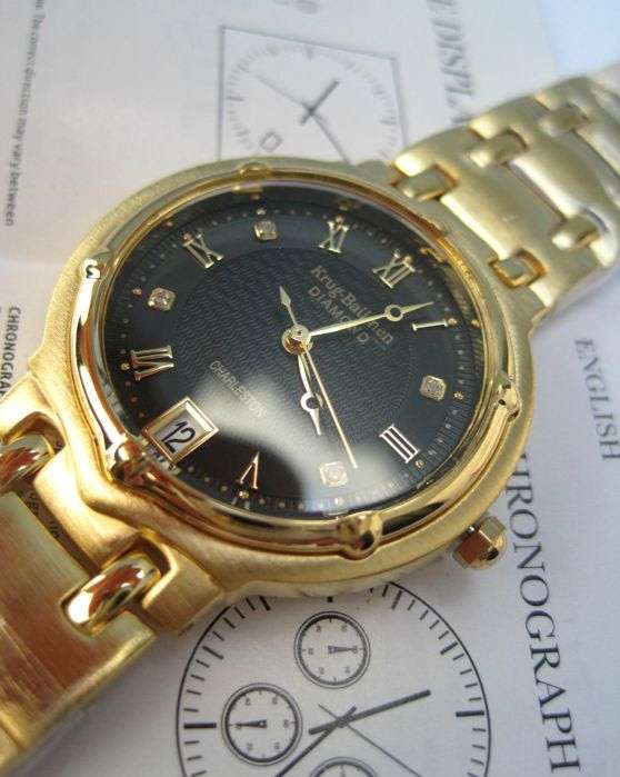 Retail: R10,714.00** Krug-Baumen MEN Charleston 4 Diamond Black Dial Gold Strap Watch