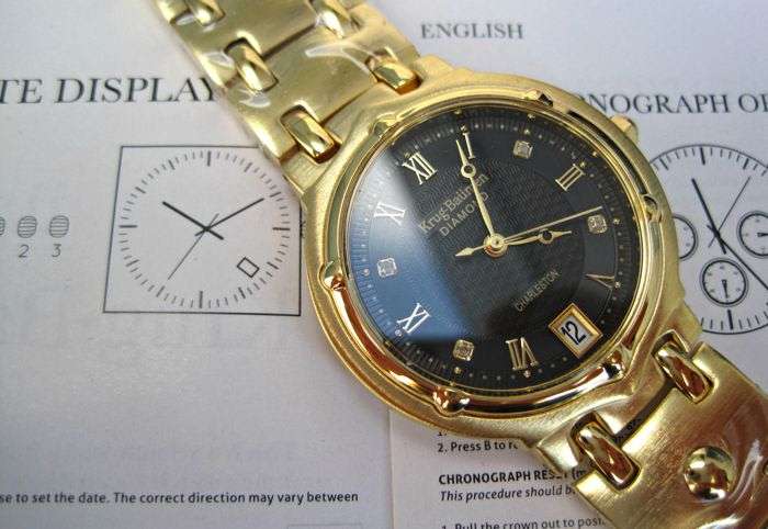 Retail: R10,714.00** Krug-Baumen MEN Charleston 4 Diamond Black Dial Gold Strap Watch