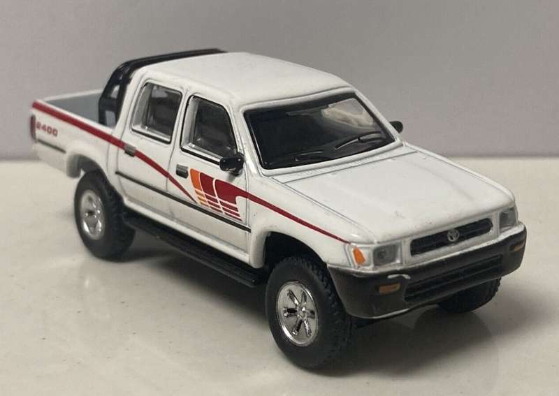 Toyota HiLux 4x4/2400 1993 white 1/64 JackieM NEW+boxed #6405 instant wheels