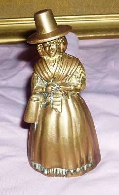 OLD BRASS BELL IN THE FORM OF A LADY