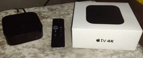 Apple tv box with remote.