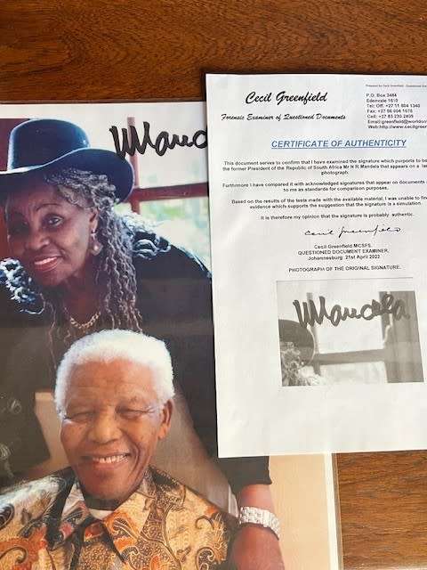 Nelson Mandela & Miriam Makeba laminated photo copy, signed by President Nelson Mandela (with COA)