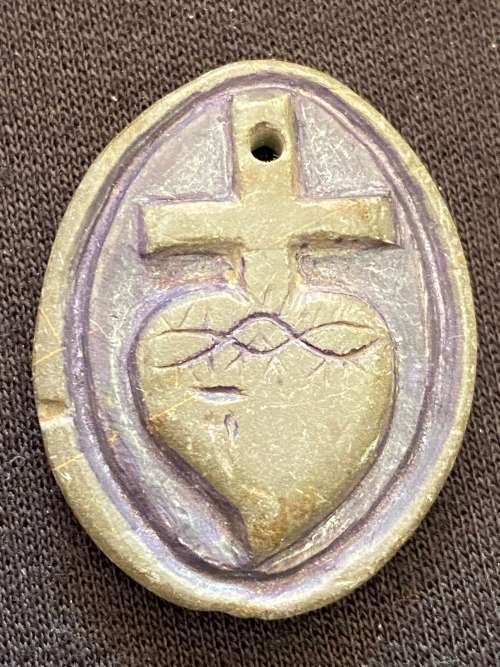 Souvenir, must be in military period. Non-metallic