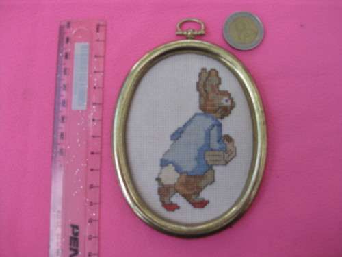 Small Peter Rabbit in cross stitch.