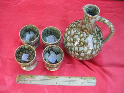Jug and 4 mugs.  Retro but there are no markings.
