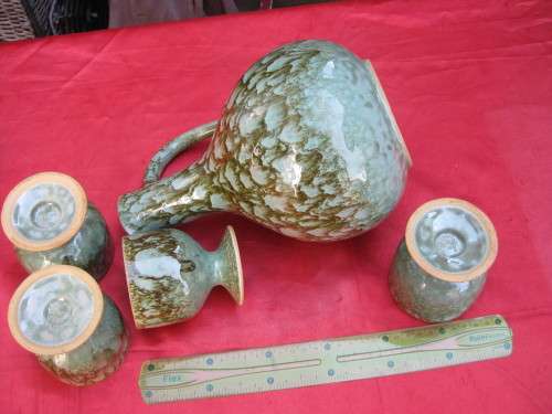 Jug and 4 mugs.  Retro but there are no markings.