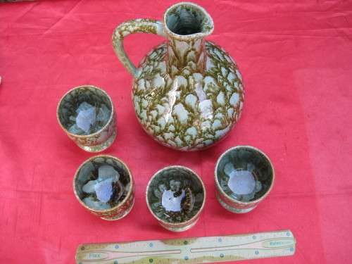 Jug and 4 mugs.  Retro but there are no markings.
