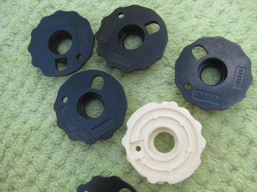 Singer machine accessories.  Stitch Pattern attachments and several plates in Singer box.