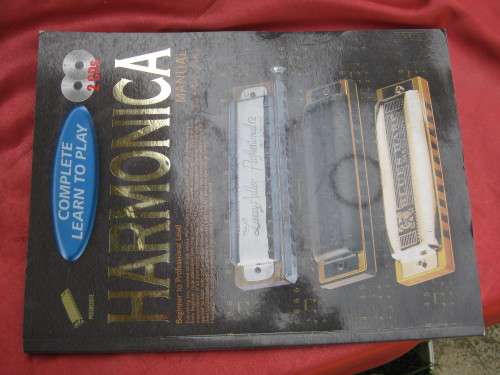 `Complete learn to play Harmonica Manual`  Soft cover.  2 CD`s.