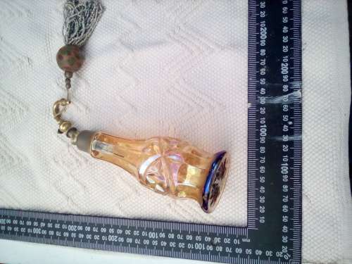 Pretty glass container with a brass screw-top attachment on top.  Not sure of its purpose - maybe sm