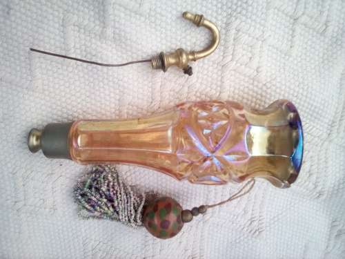 Pretty glass container with a brass screw-top attachment on top.  Not sure of its purpose - maybe sm