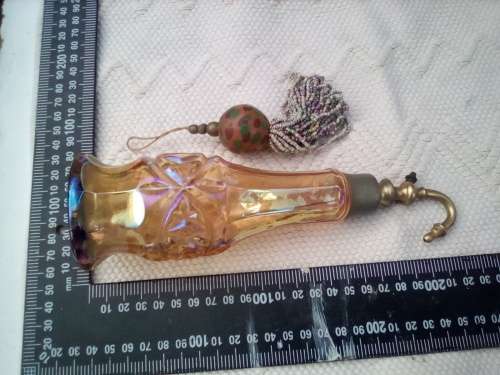 Pretty glass container with a brass screw-top attachment on top.  Not sure of its purpose - maybe sm