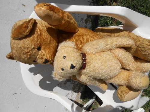 Retro, large (700mm high), straw-filled teddy bear with a small modern friend.