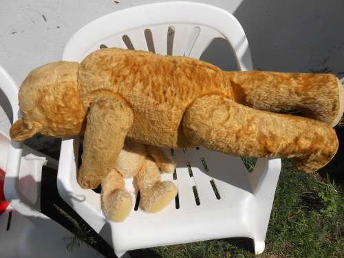 Retro, large (700mm high), straw-filled teddy bear with a small modern friend.