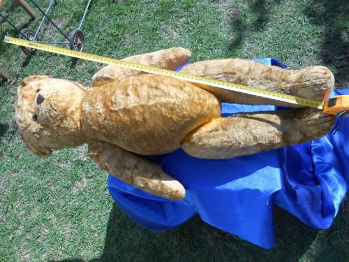 Retro, large (700mm high), straw-filled teddy bear with a small modern friend.
