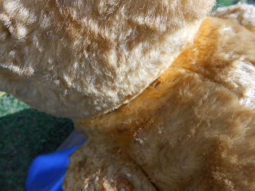 Retro, large (700mm high), straw-filled teddy bear with a small modern friend.