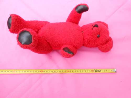 Red `Reindeer` label teddy bear.  Made in South Africa. 400mm high. Hole in right paw and foot.
