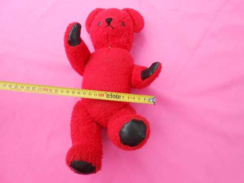 Red `Reindeer` label teddy bear.  Made in South Africa. 400mm high. Hole in right paw and foot.