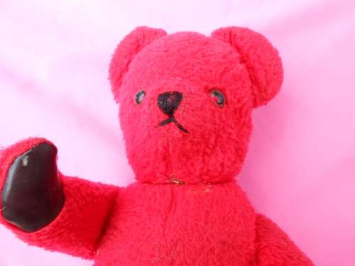 Red `Reindeer` label teddy bear.  Made in South Africa. 400mm high. Hole in right paw and foot.