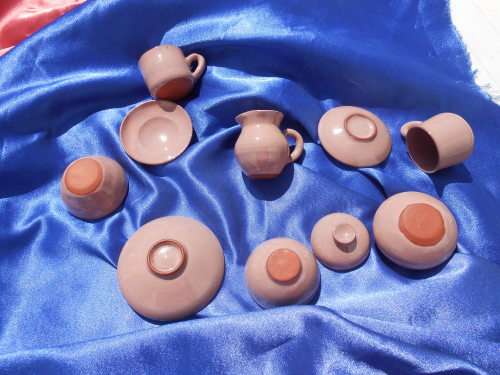 Very small, ceramic, sugar bowl, milk jug, 2 cups and saucers, 2 bowls and one cake plate.