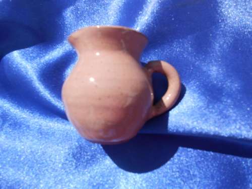 Very small, ceramic, sugar bowl, milk jug, 2 cups and saucers, 2 bowls and one cake plate.