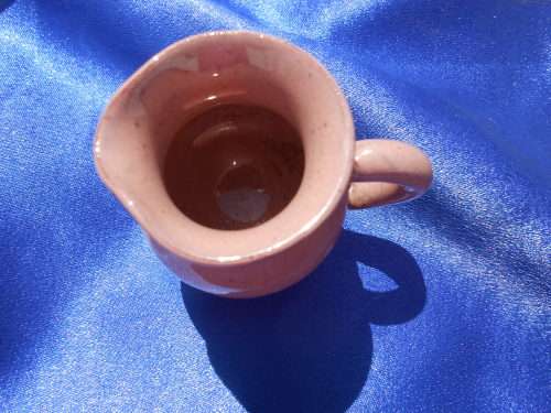 Very small, ceramic, sugar bowl, milk jug, 2 cups and saucers, 2 bowls and one cake plate.