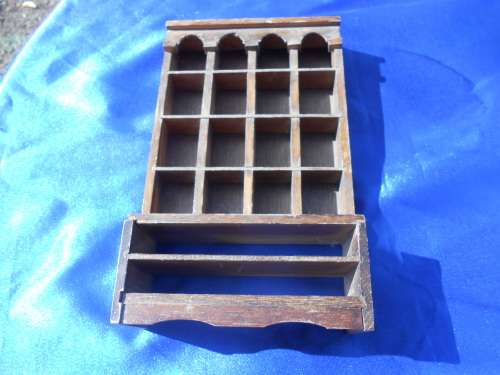 Doll`s house furniture or thimble display rack.