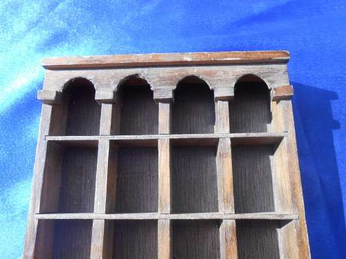 Doll`s house furniture or thimble display rack.